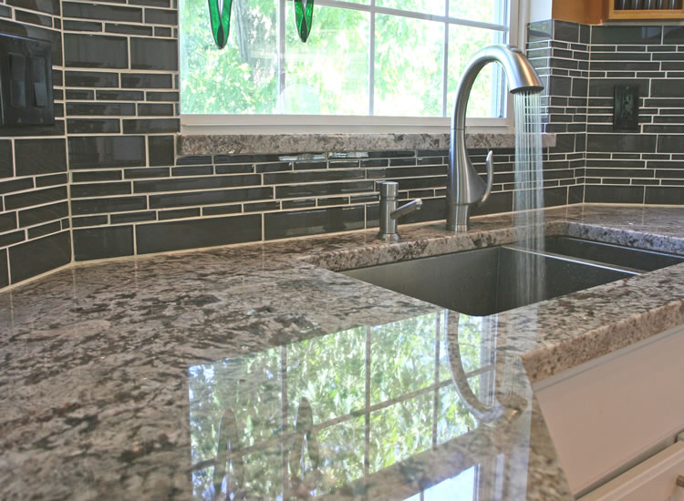 Backsplash is glass and looks much prettier